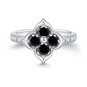 Dainty black moissanite engagement ring in a unique four-leaf clover flower setting.