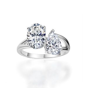 Two stone moissanite engagement ring with oval and pear cut stones