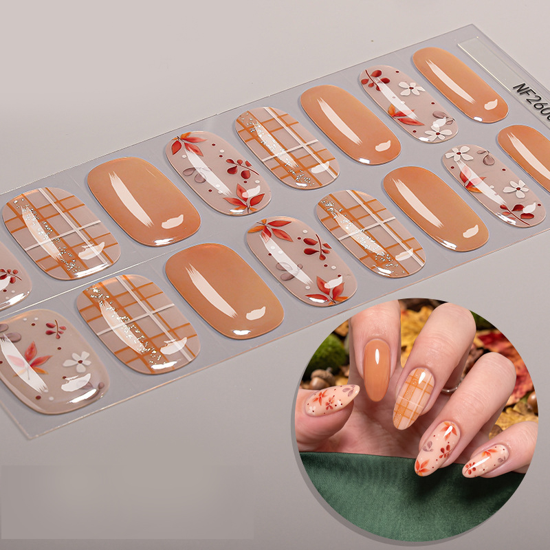 Cute fall‑themed semi‑cured gel nail wraps featuring delicate leaves, flowers and plaid print