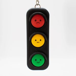 Cute traffic‑light shaped fidget clicker keychain made of PLA. 3 clickable buttons with fun faces